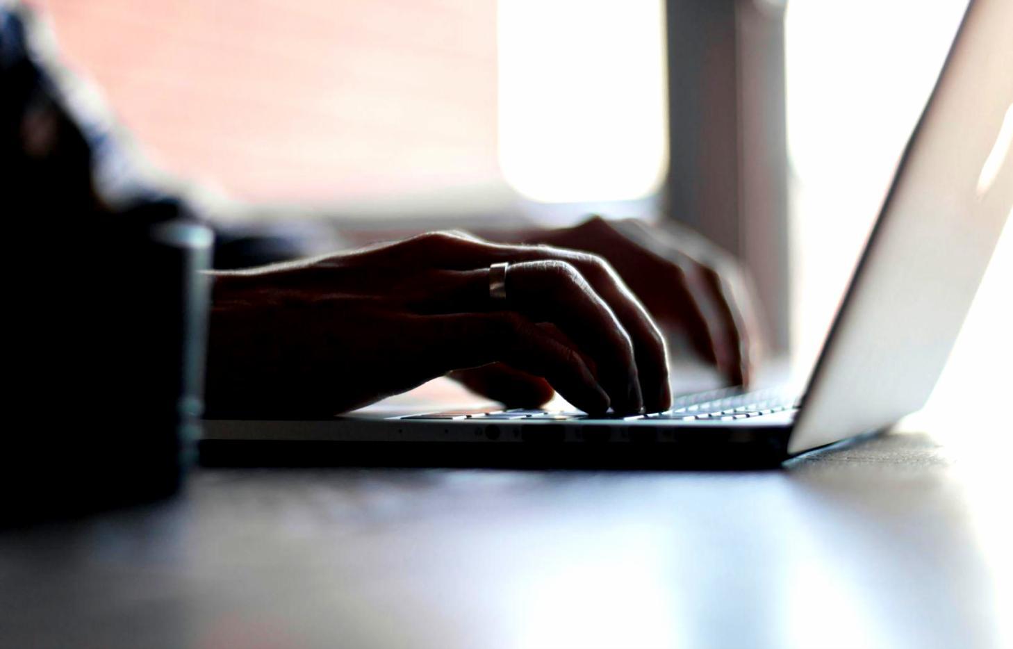 Person reviewing financial documents and charts