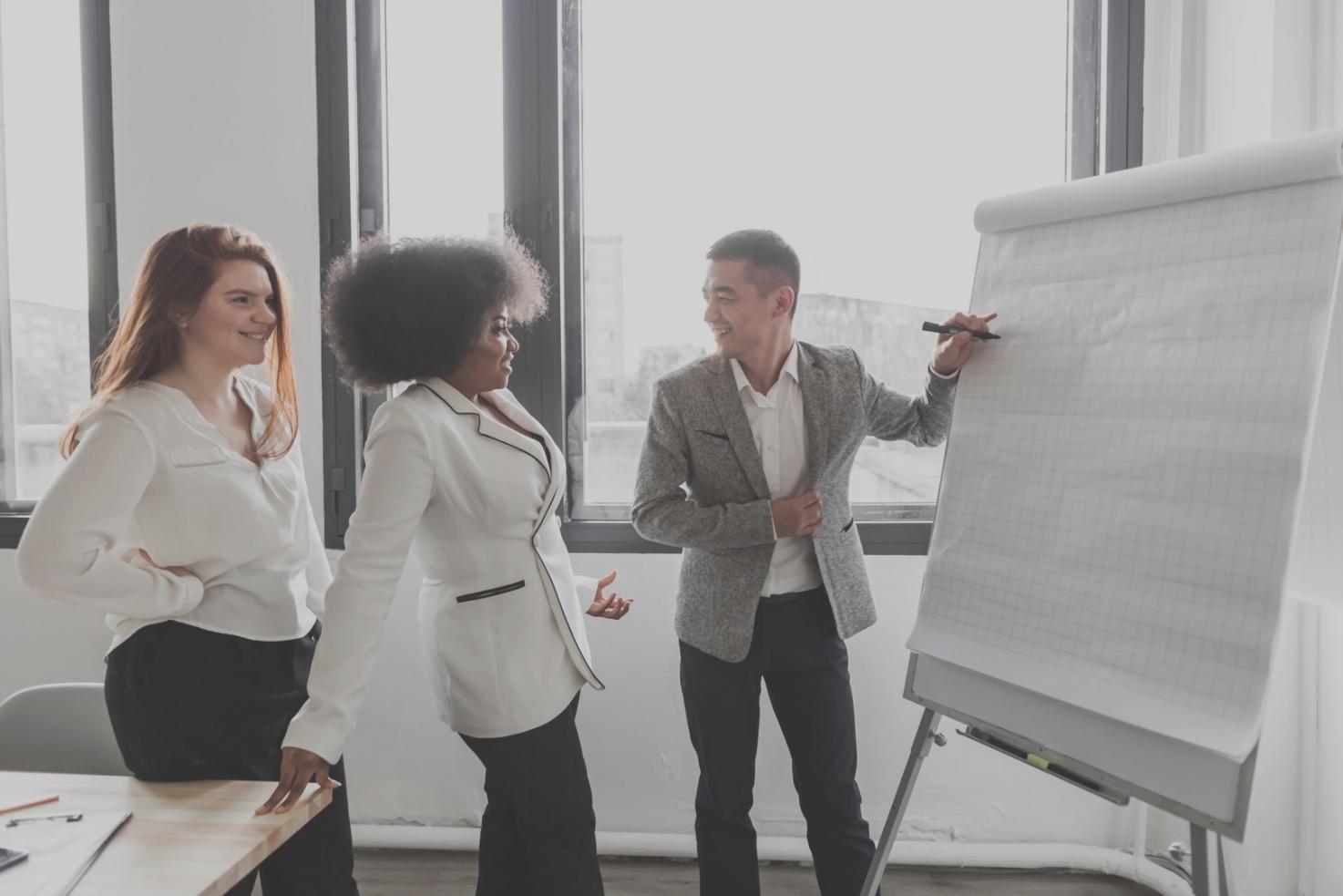 Person working on debt elimination planning with calculator and papers